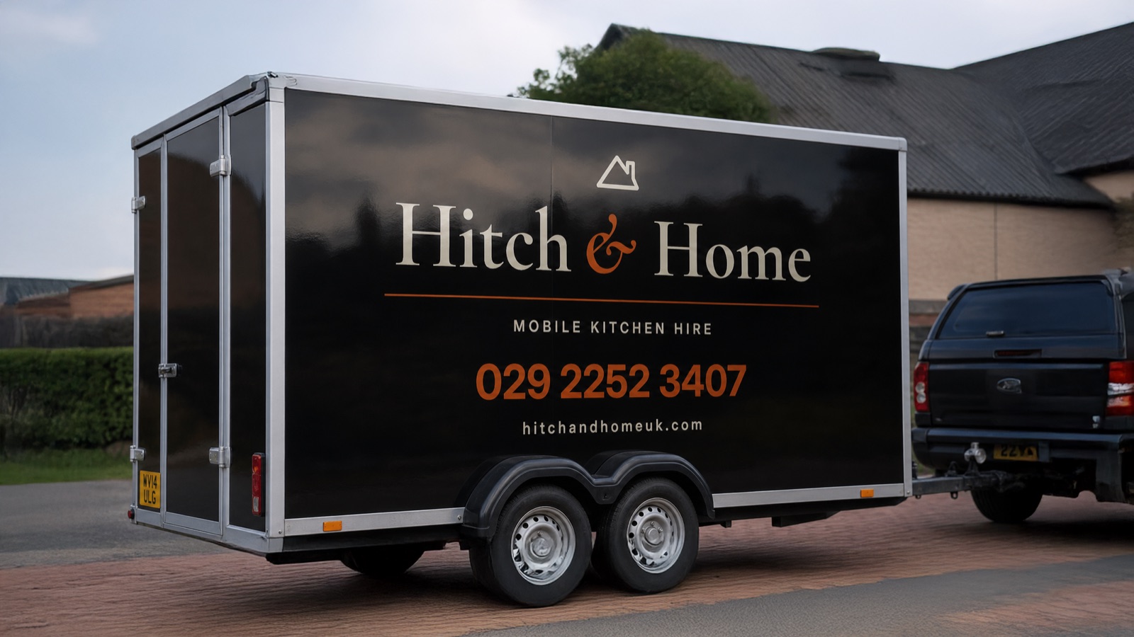 Hitch and Home trailer parked outside a house